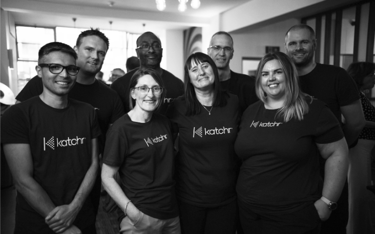 A black and white photograph of some of the Katchr legal analytics team.